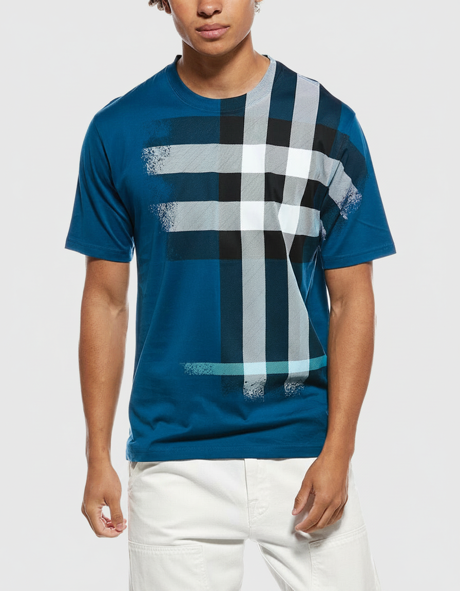 Man wearing a teal t-shirt with a large, abstract plaid print.