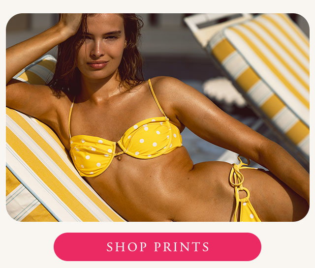 Model wearing yellow polka dot bikini. Shop now. 