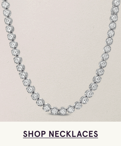 Silver tennis necklace with round diamonds. Click here to shop necklaces