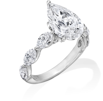 Pear shaped engagement ring with diamonds on the band.
