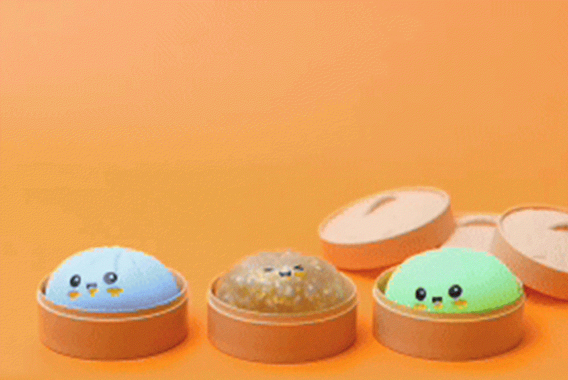 Animation of hands with chopsticks picking up dumpling toys from their steamer containers