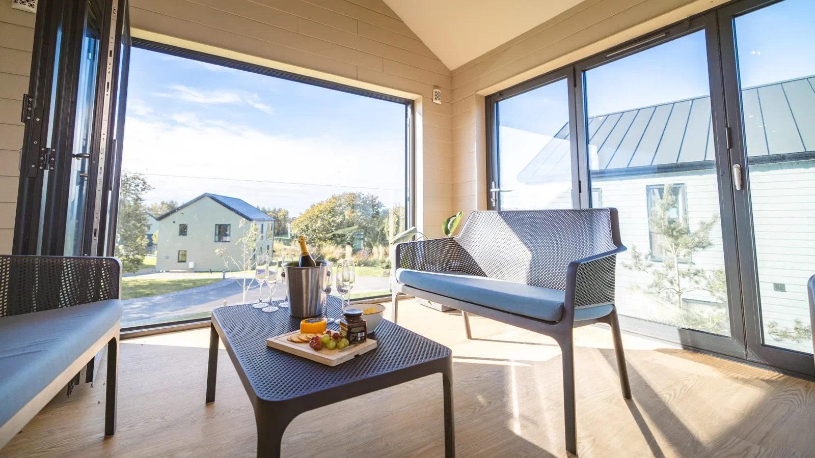 Champagne and cheese board in a Bluestone Platinum Lodge