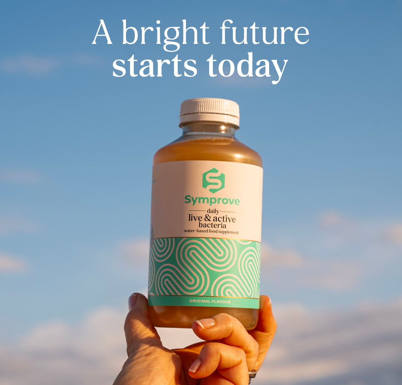 A bright future starts today. Image of Symprove being held up against the blue sky.