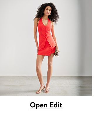 A woman wearing a matching vest-and-skirt set from Open Edit.