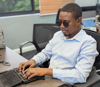 Erick Mlasani, former student turned academic through access to braille technology.