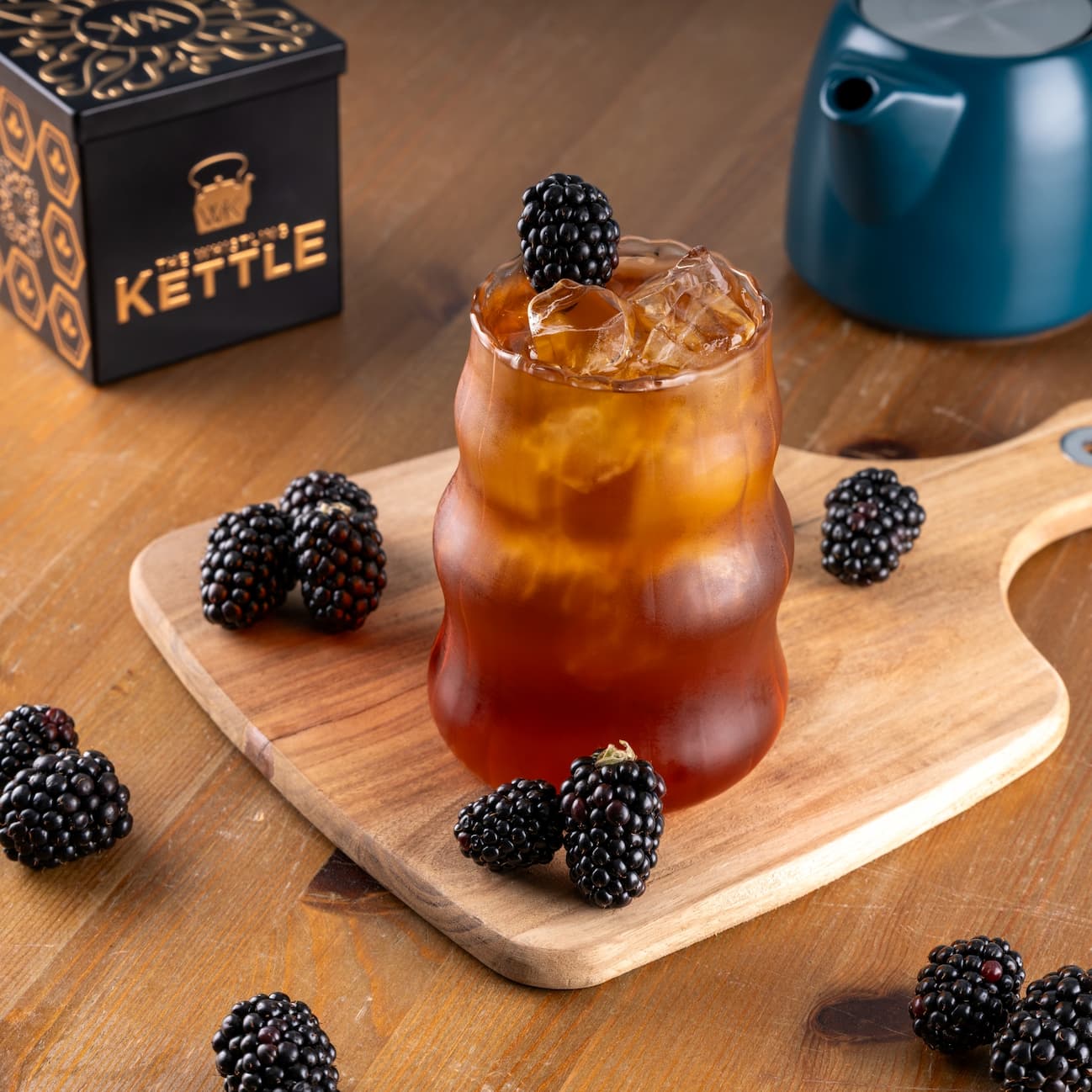 Blackberry Fig iced tea surrounded by fresh blackberries
