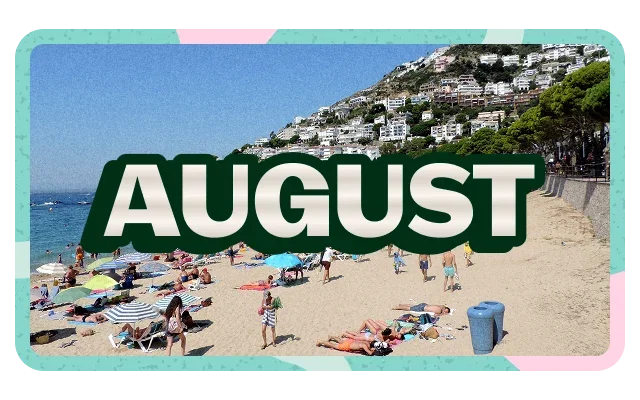 Mint green and pink border shapes, 'AUGUST' dark green bold text with cream outline, clear blue sky gradient, steep hillside, white Mediterranean buildings, dark green trees, calm blue-green sea, small boat, beige-tan sandy beach, beachgoers, colourful towels, blue red orange striped, beach chairs and paved promenade.