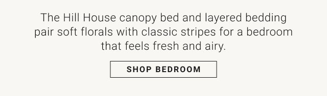 The Hill House canopy bed and layered bedding pair soft florals with classic stripes for a bedroom that feels fresh and airy. SHOP BEDROOM