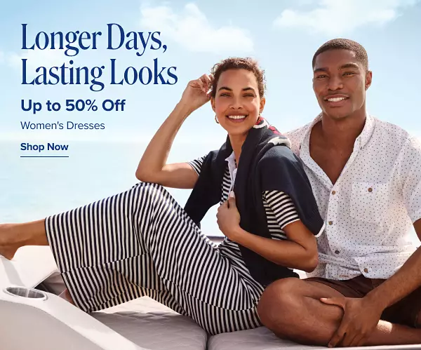 Longer days, lasting looks. Up to 50% off womens dresses. Shop now. A woman and a man sitting on a boat wearing well dressed clothes.