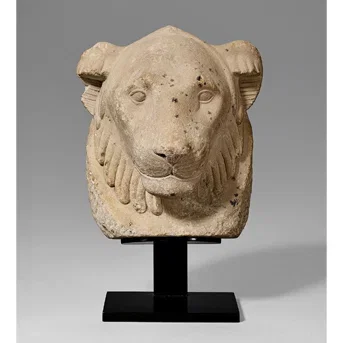 An Egyptian Limestone Lion Head