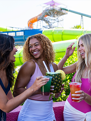 A group of friends enjoying frozen drinks during Adventure Island's Happy Hour 