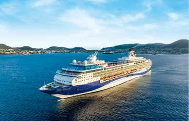 Winter 2027 cruise promotion showcasing a Marella ship sailing under clear skies, highlighting escape-to-warm destinations.