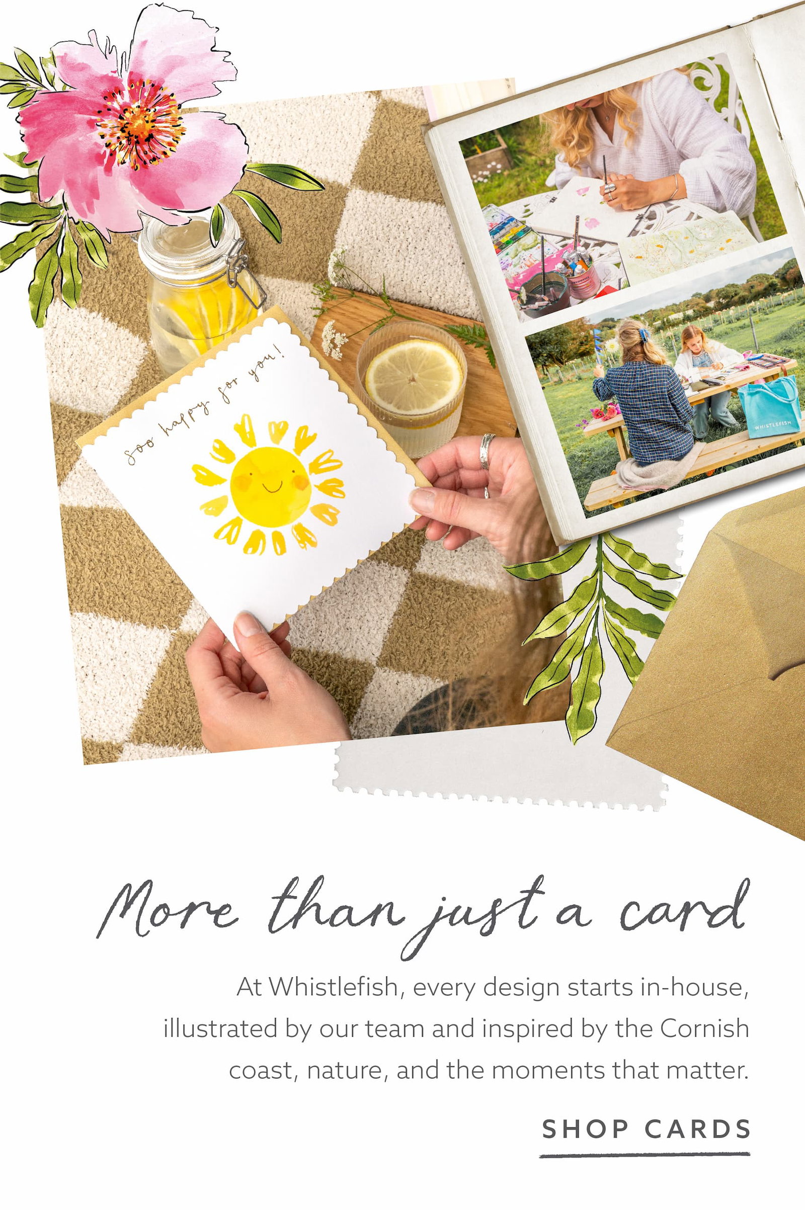 A hand holding a cheerful sunshine greeting card beside a scrapbook of artwork and creative moments, highlighting the Whistlefish in house design process inspired by Cornwall and everyday life.