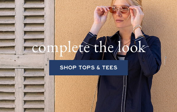 Complete the Look - Shop the Tops & Tees - Image of a woman wearing a navy button up shirt with 