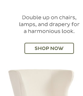 Double up on chairs, lamps, and drapery for a harmonious look. - Shop Now