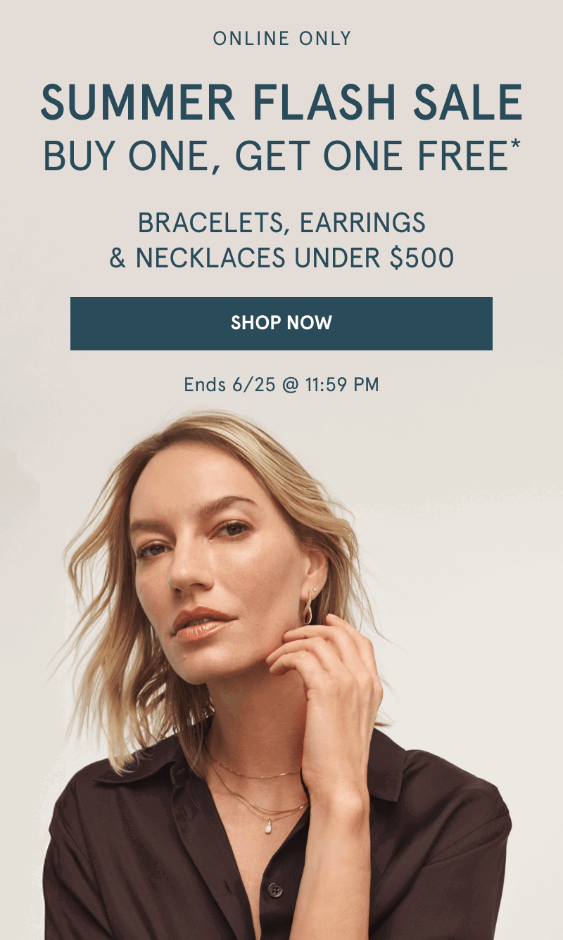 Woman wearing layered yellow gold chains and stacked earrings. Buy one, get one free. Jewelry under $500. Click shop now.