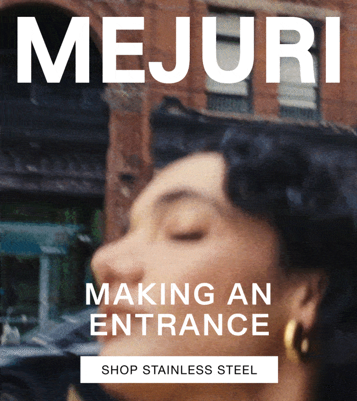 Close-up of a woman's ear wearing a Mejuri gold hoop — Making an Entrance, Shop Stainless Steel.
