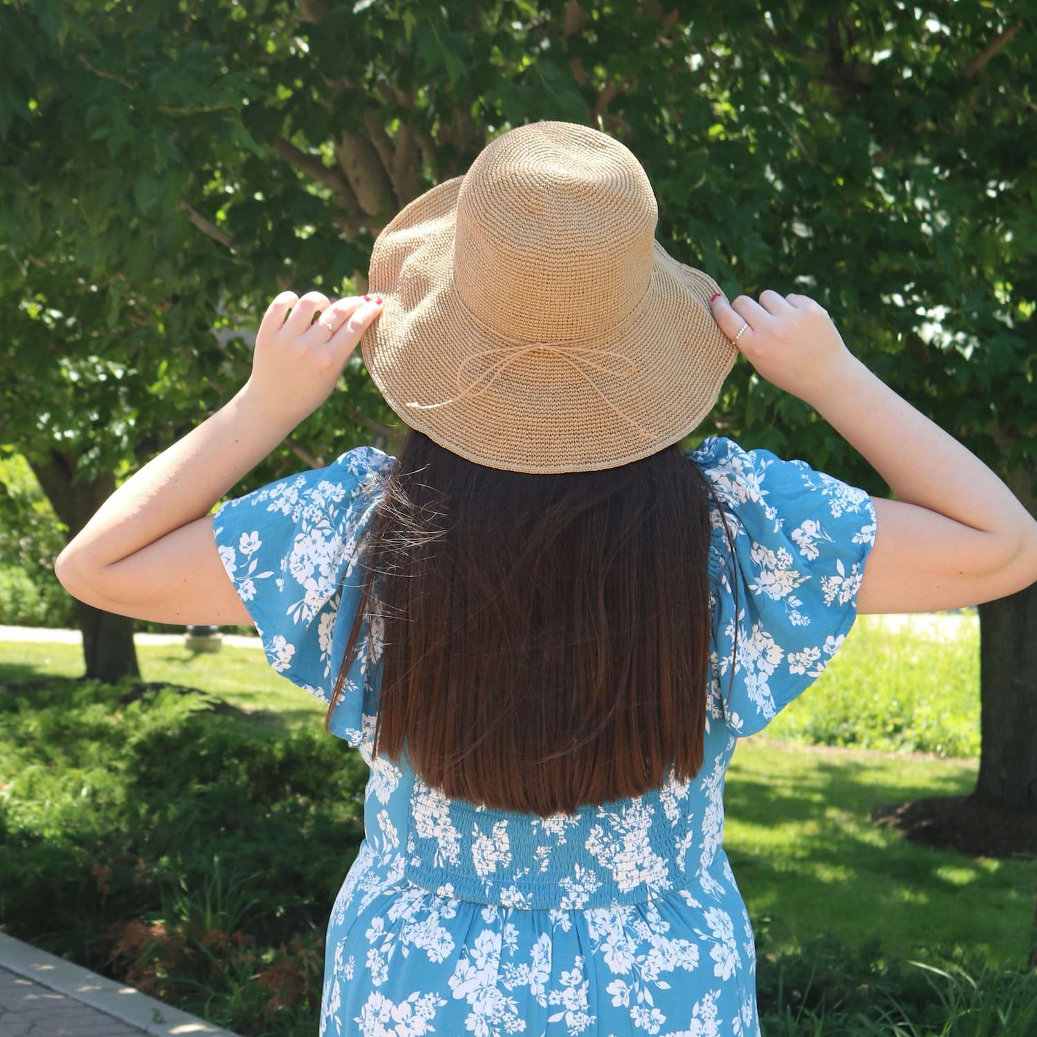 Woman wearing straw summer hat