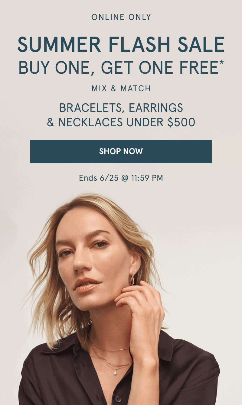 Woman wearing layered yellow gold chains and stacked earrings. Buy one, get one free. Jewelry under $500. Click shop now.