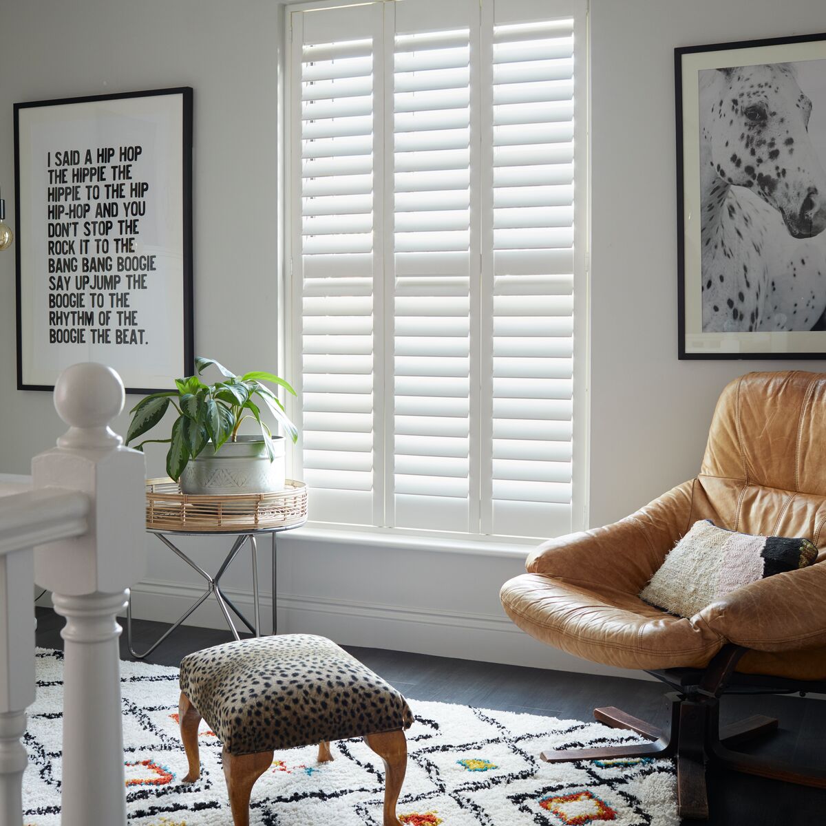 White shutters on a window in a modern living space