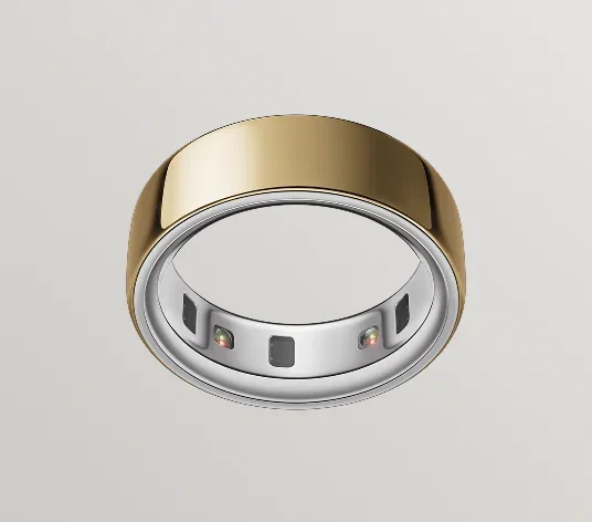 Oura Ring 4 in gold finish, viewed from below showing recessed health sensors