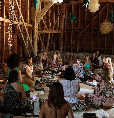 A group of people taking part in a breath work session.