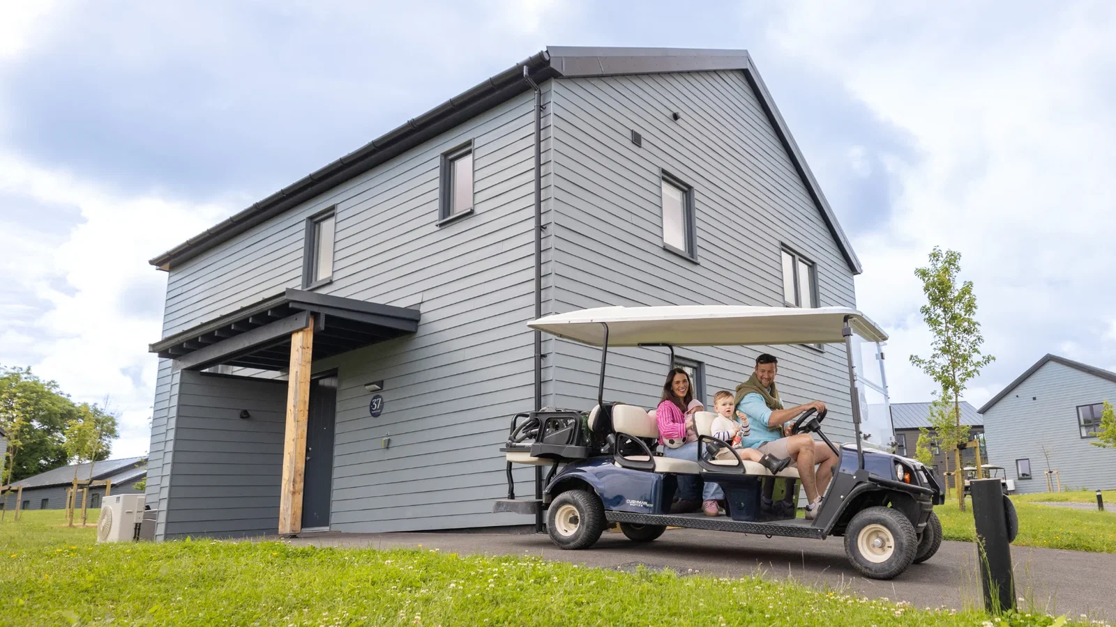 Family about to set off in their buggy in front of their platinum lodge