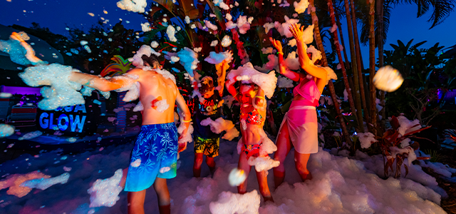Group of friends enjoying the AquaGlow Event at Adventure Island