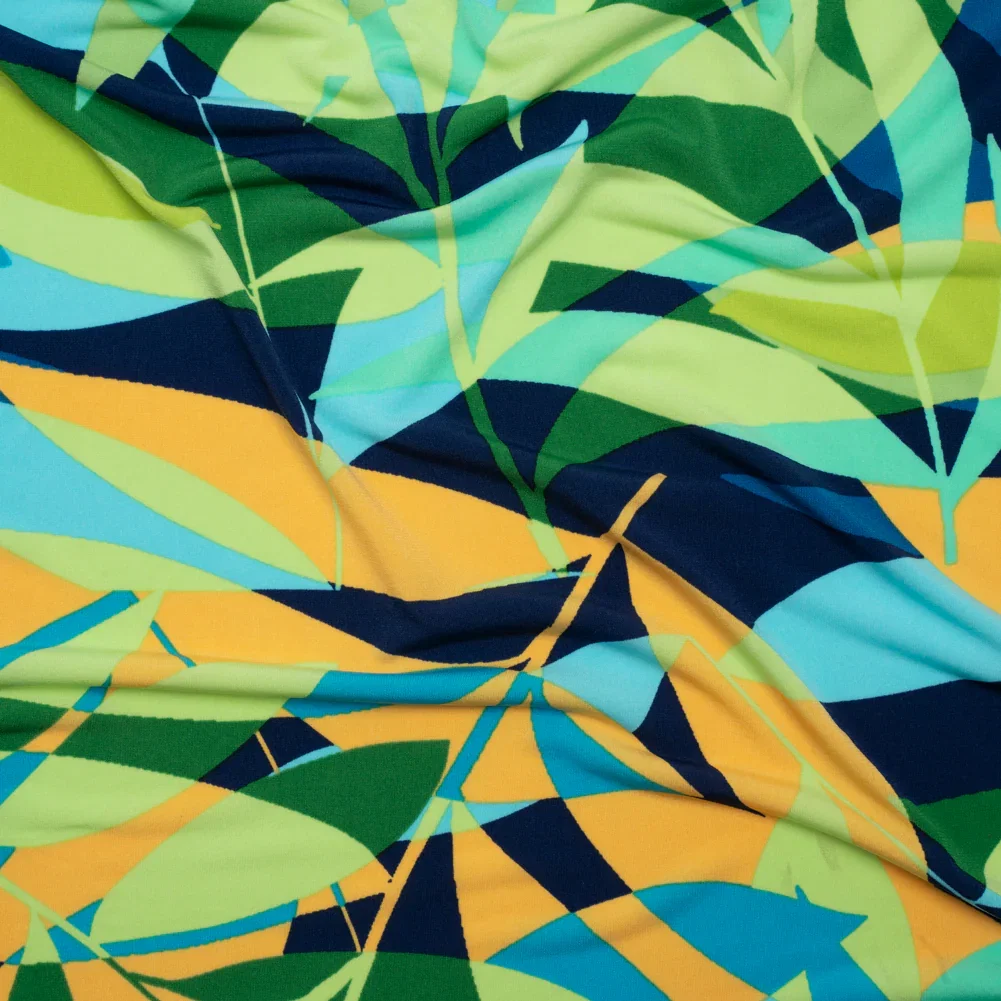 Image of Stretch Polyester Tricot - Green, Blue and Goldenrod Overlapping Palm Leaves - Designer Deadstock