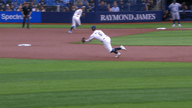 An animated gif of Taylor Walls making a diving stop and throw to first
