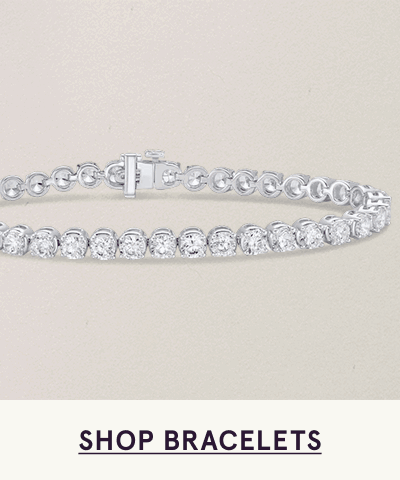 Silver tennis bracelet with continuous row of round stones. Click here to shop bracelets