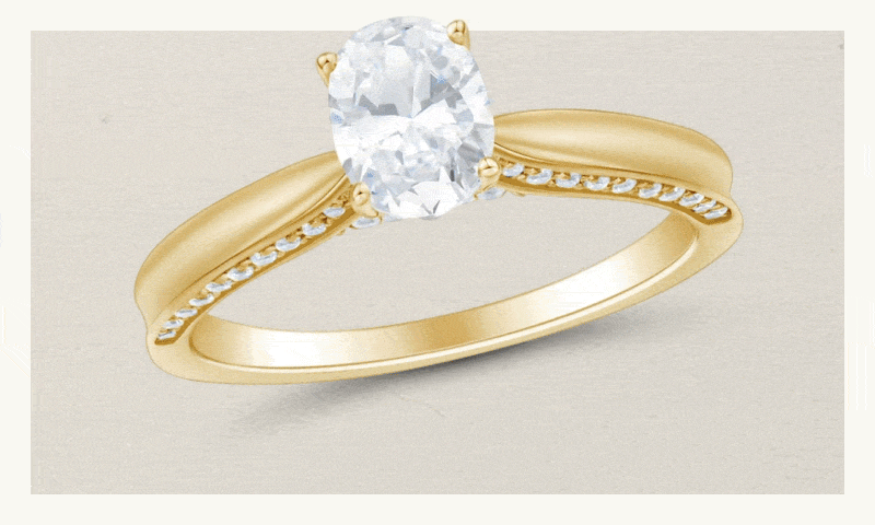 Rotating diamond rings: oval solitaire, emerald-cut halo with side stones & pear-shaped cluster design.
