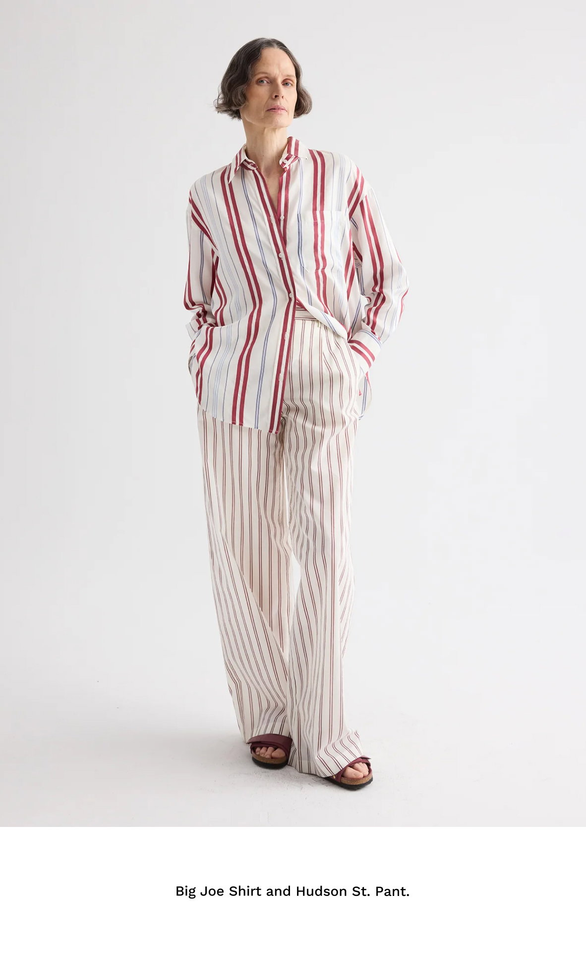 Image of a model in a red, white, and blue striped outfit with black text beneath.