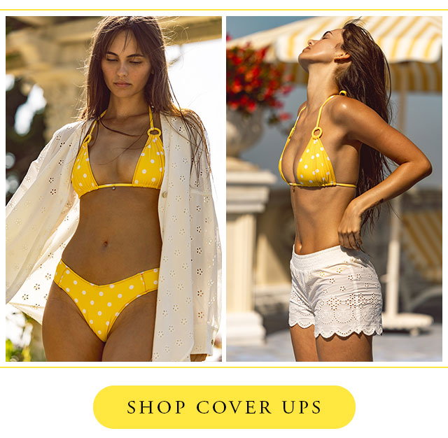 Model wearing yellow polka dot bikini with white eyelet shirt and cover up shorts. Shop cover ups. 