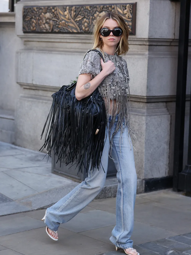 LONDON, ENGLAND - JUNE 19: Milly Alcock in sunglasses seen returning to her hotel ahead of a 'Supergirl' photocall on June 19, 2026 in London, England. (Photo by Neil Mockford/GC Images)