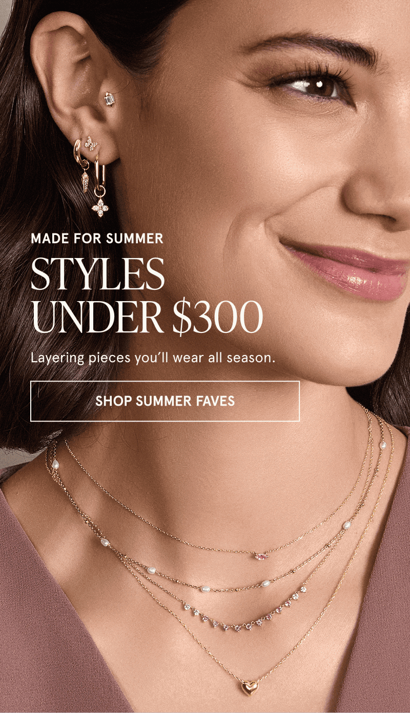 A model wearing gold gemstone jewelry. Made for summer. Styles under $300. Click here to shop summer faves