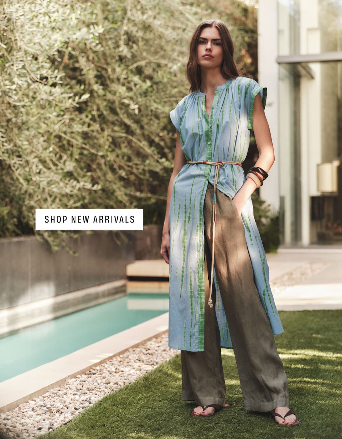 Image shows a model wearing the Jada Dress in Sky Blue. Text reads : Shop New Arrivals