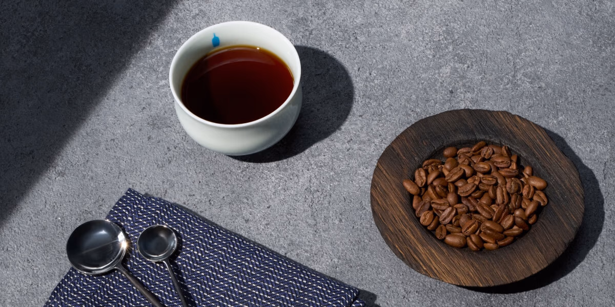 Coffee cup and coffee beans.