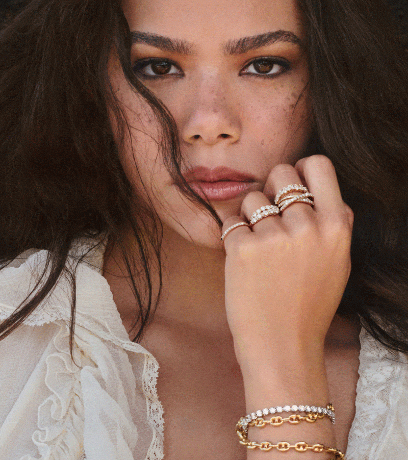 Image of a woman with jewelry prominently worn