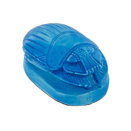 Miniature beetle-shaped ornament with a glossy blue finish. - Shop Now.