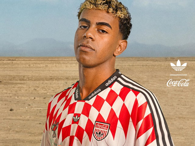 model wearing a coca cola soccer jersey
