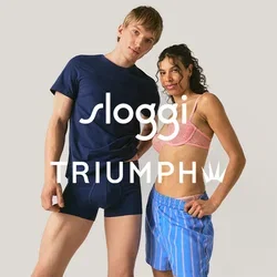 Een man in een marineblauw T-shirt en boxershort staat naast een vrouw in een roze beha en blauw gestreepte shorts tegen een effen achtergrond.