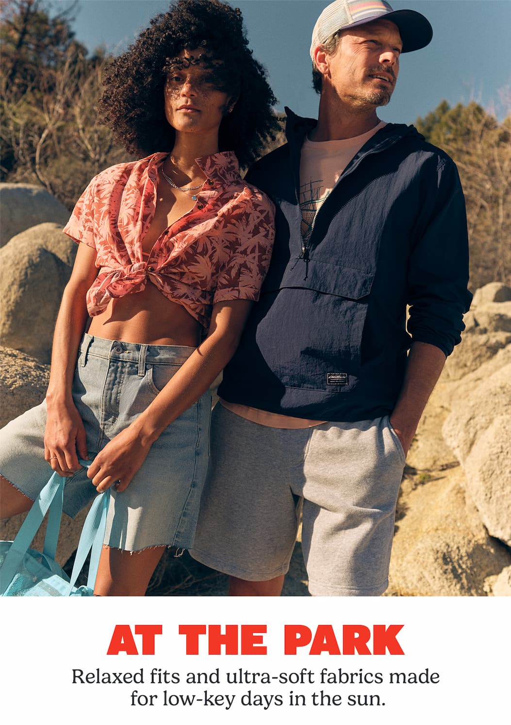 Woman and man standing in the sun.