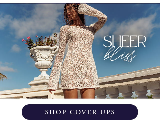 Model wearing white lace dress. Shop cover ups. 