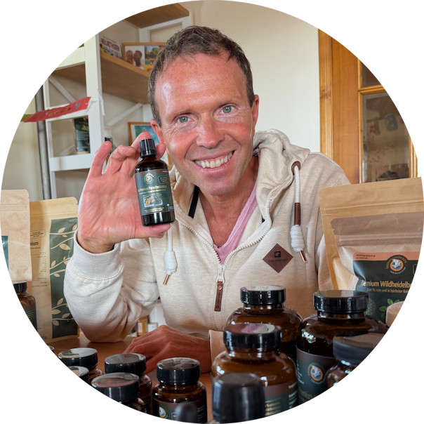 an image of a man holding a bottle of medicine in front of a table