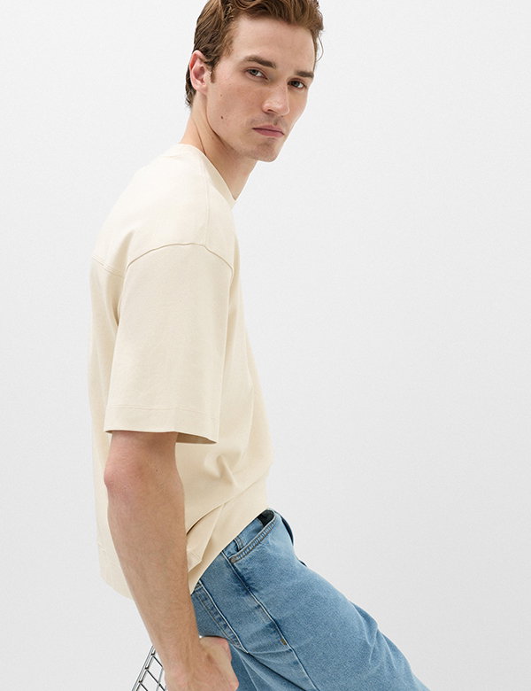 Man wearing Cotton Rich Crew Neck T-Shirt with Lyocell in Ecru
