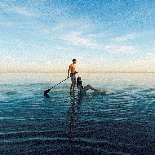 A couple paddleboarding.