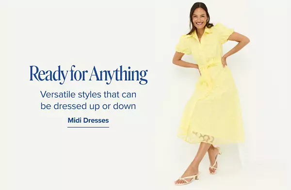 A woman in a yellow midi dress. Versatile styles that can be dressed up or down. Midi dresses.