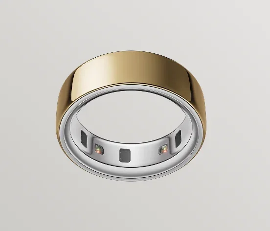 Oura Ring 4 in gold finish, viewed from below showing recessed health sensors