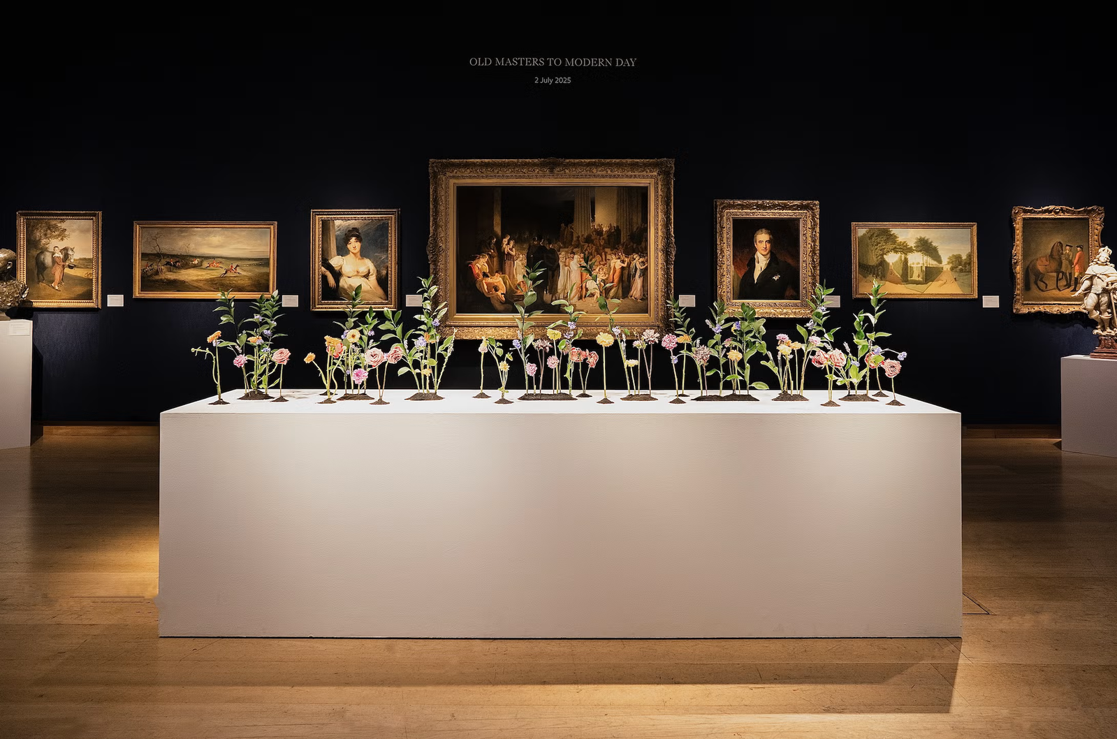 art exhibition featuring floral displays and classical paintings